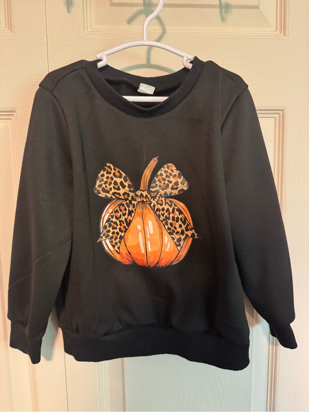 Black Women's Pullover Sweater with Orange Pumpkin Graphic